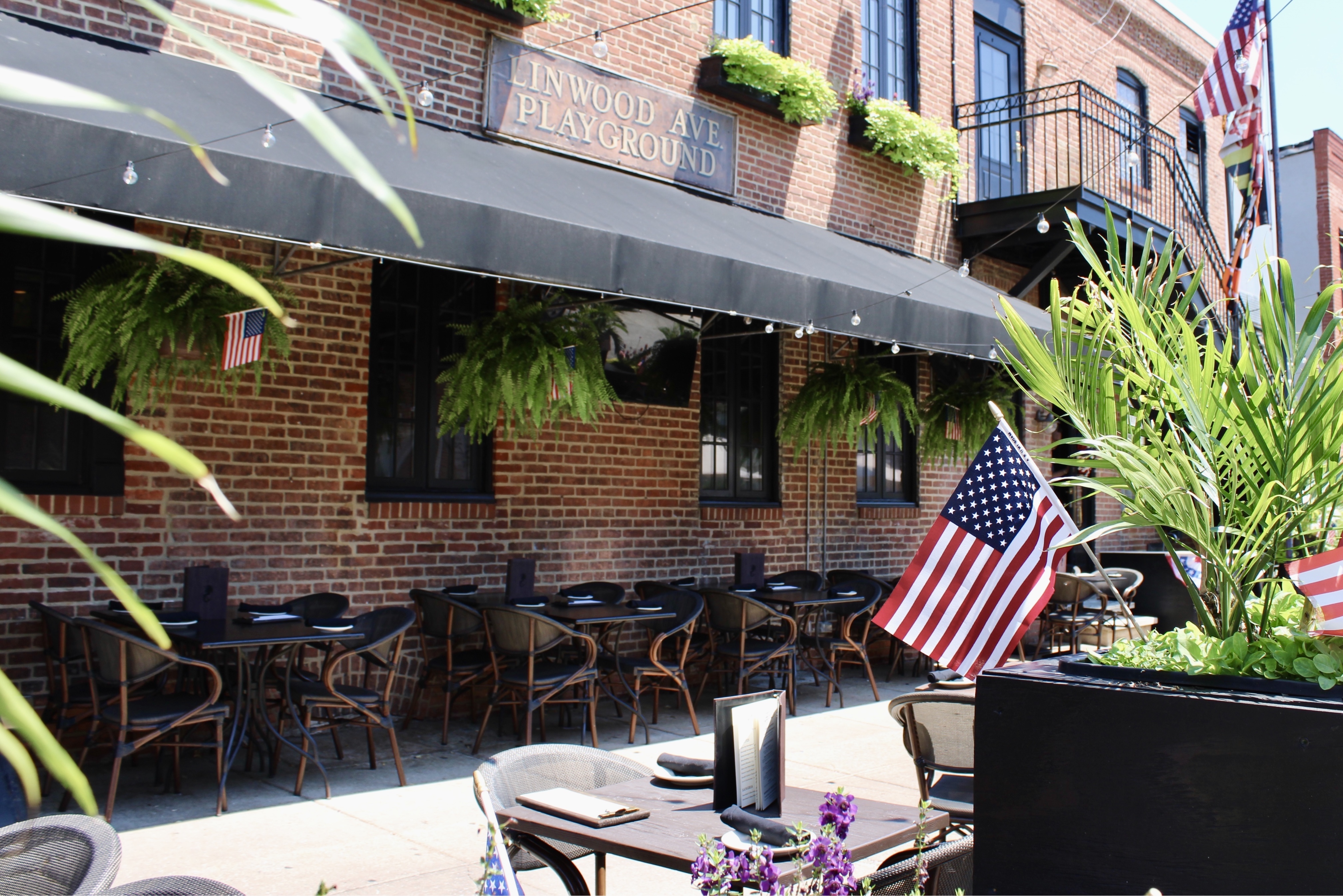 Mama's On The Half Shell Baltimore Outdoor Dining Area dressed in American flags for Fourth of July 