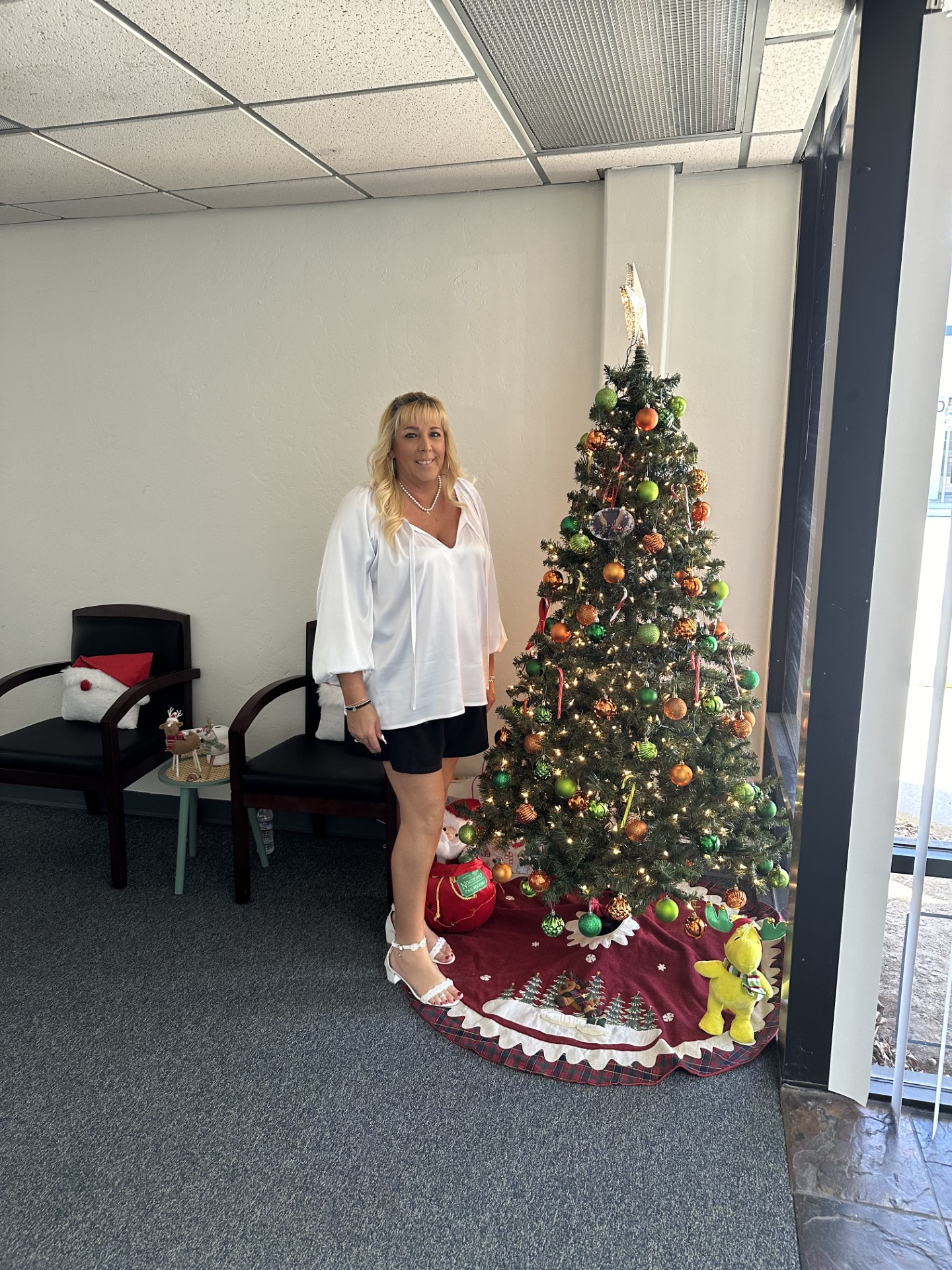 Our Amazing Amanda getting our SERVPRO tree ready for the holidays here!