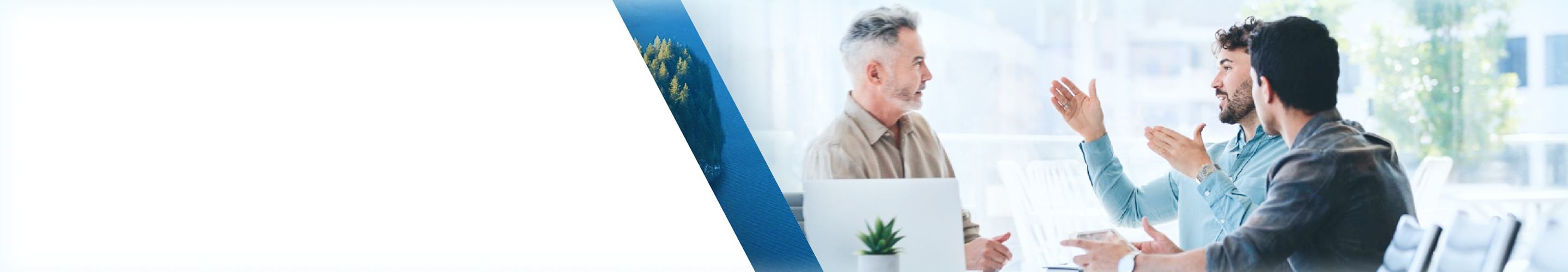 Three people having a meeting in a boardroom.