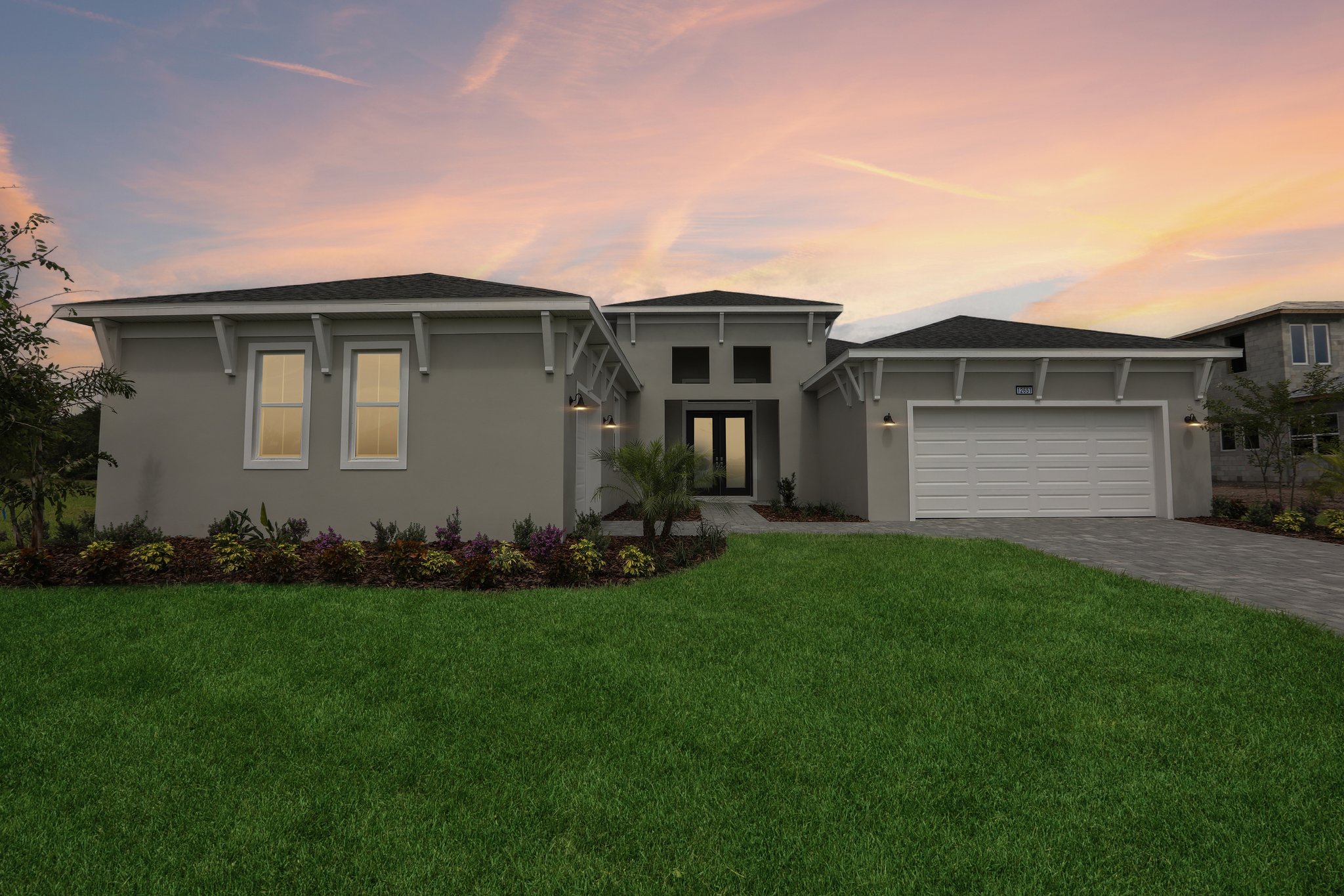 The Front Elevation of a DRB Homes Sabal Home Plan at Serengeti in Spring Hill, FL. 