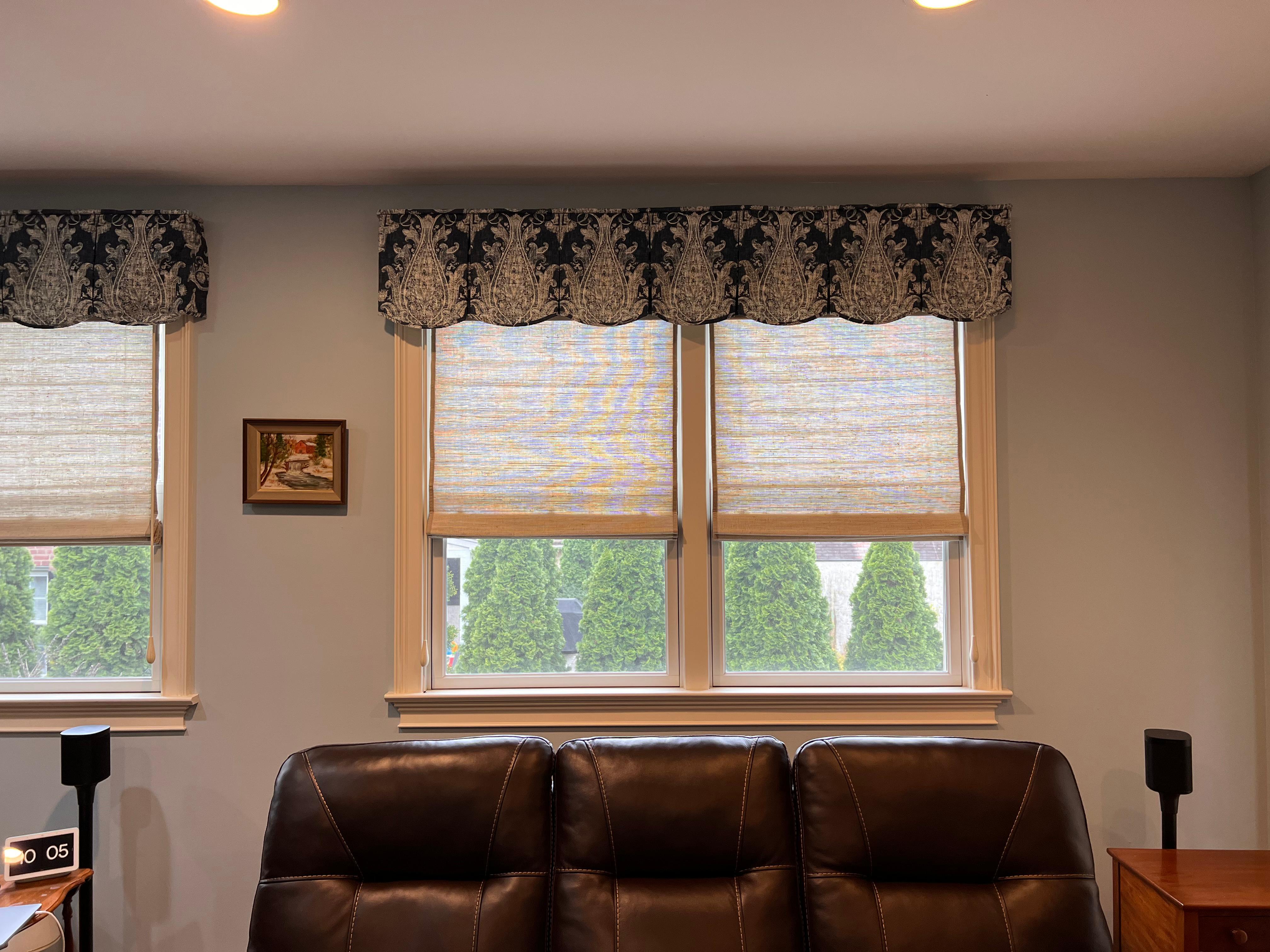 Beautiful woven woods shade with board mounted valance.