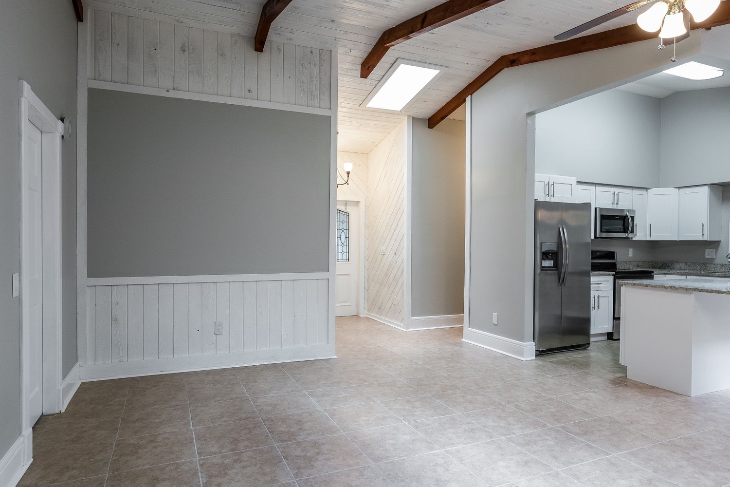 Breakfast nook with easy access to modern kitchen at Invitation Homes South Florida.