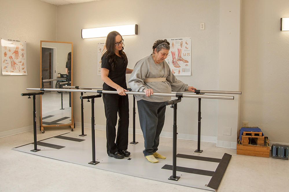 Physical therapist helping a patient