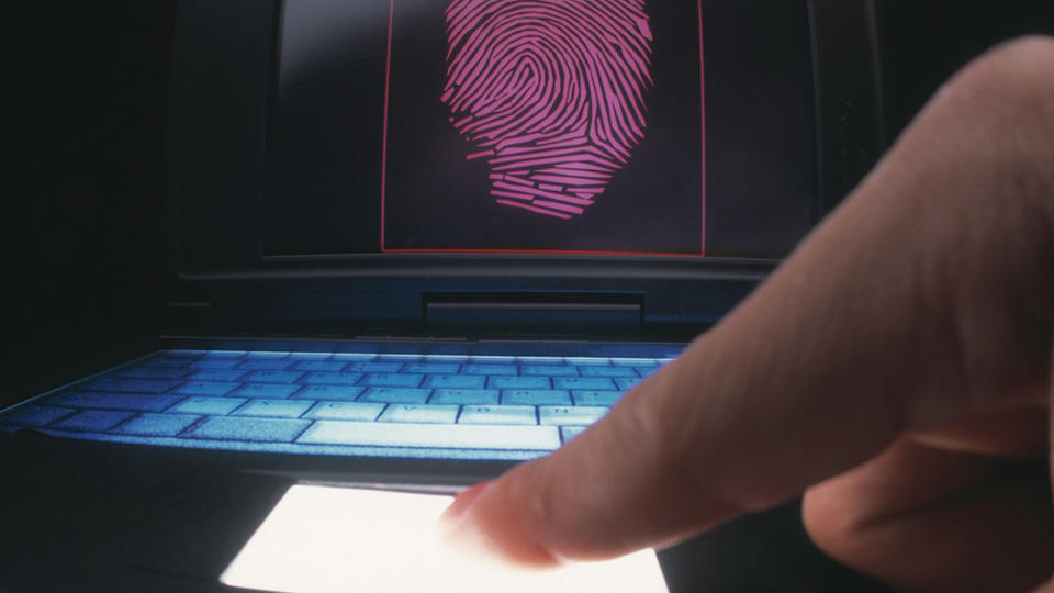 person leaving fingerprint on computer