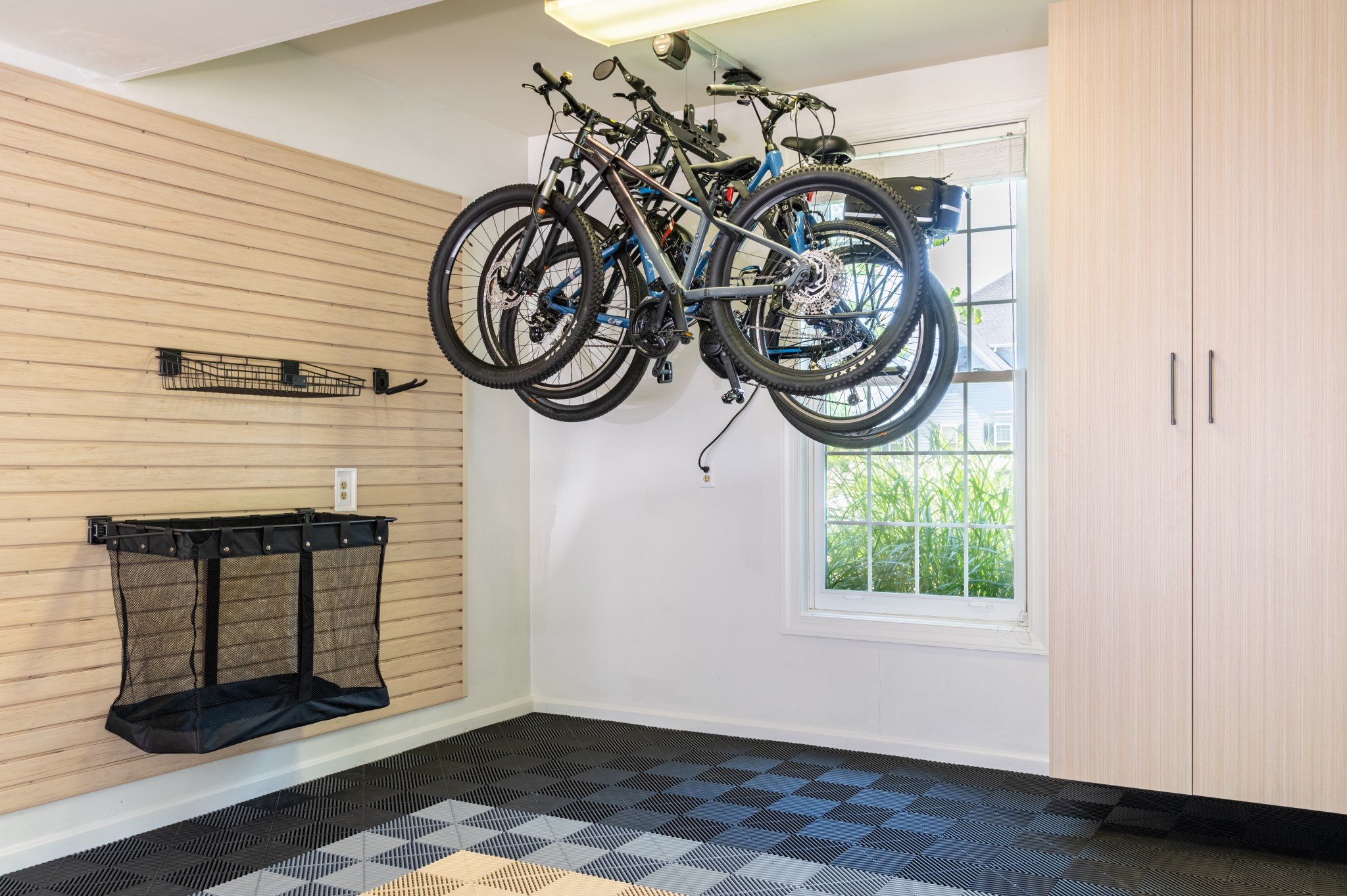 No room for bikes? No problem! This bluetooth-enabled bike lift helped this Lancaster, PA garage owner take back their space and make room for more! Contact us to learn more about smart lifts to enhance your garage today.
