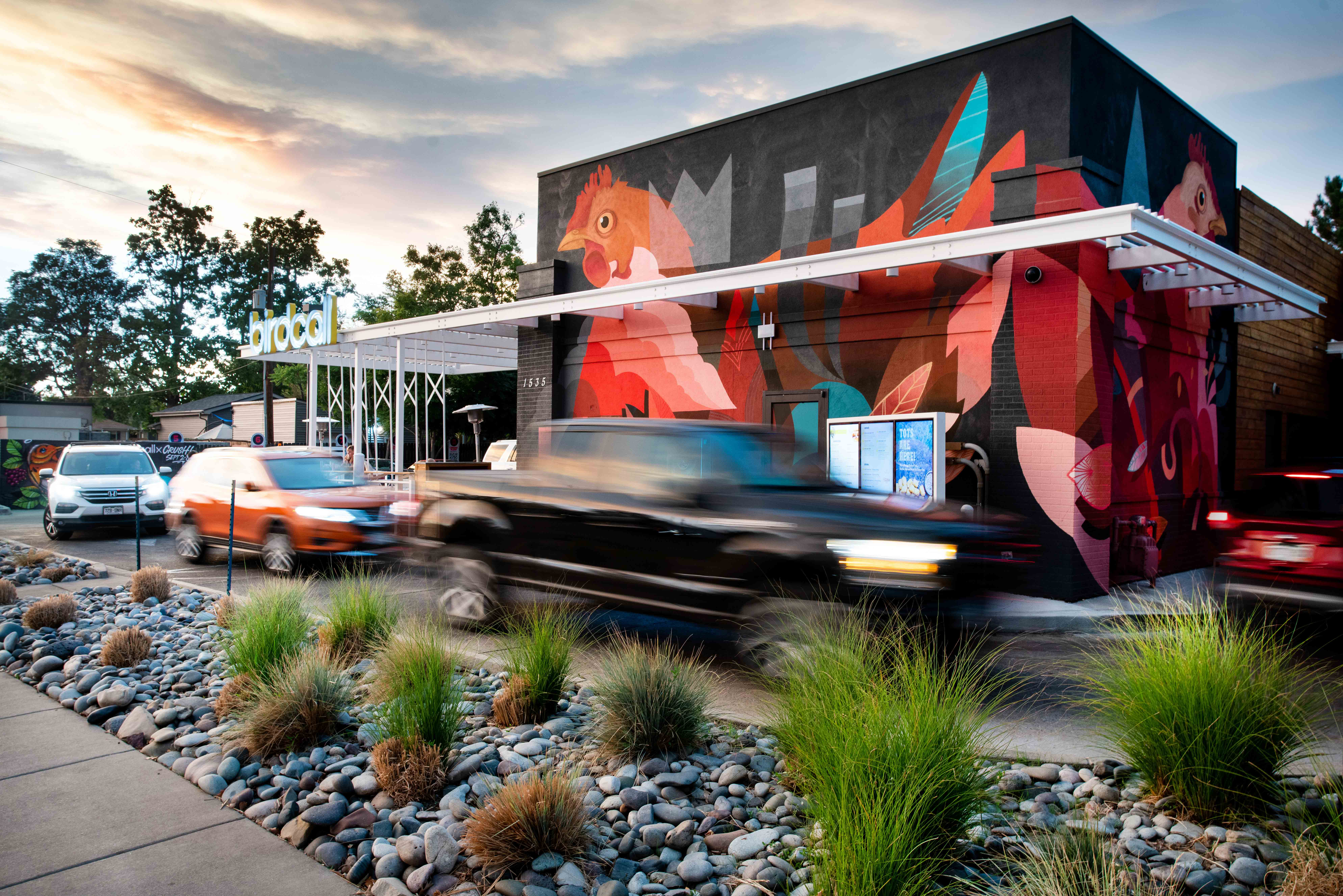 Exterior image of Birdcall Evans, highlighting the drive-thru and spacious patio