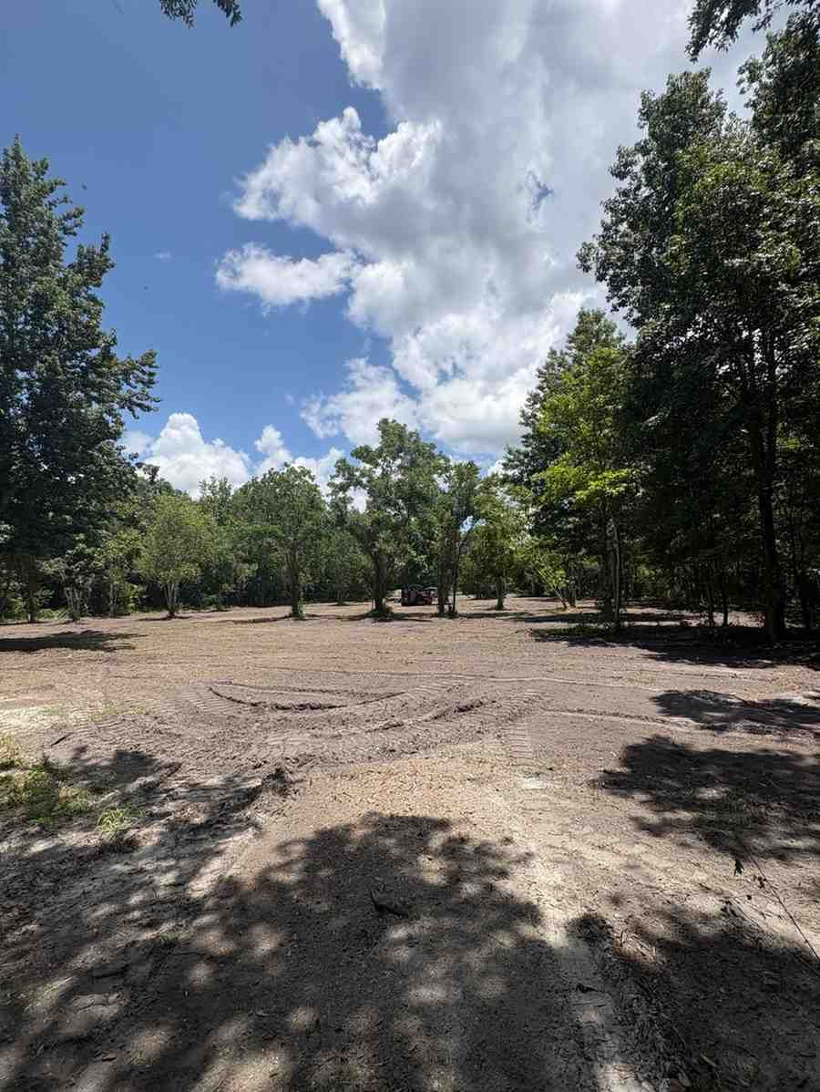 Prepared property featuring leveled ground and improved open space following vegetation removal, supporting residential development, landscaping projects, recreational use, and long-term land management goals.