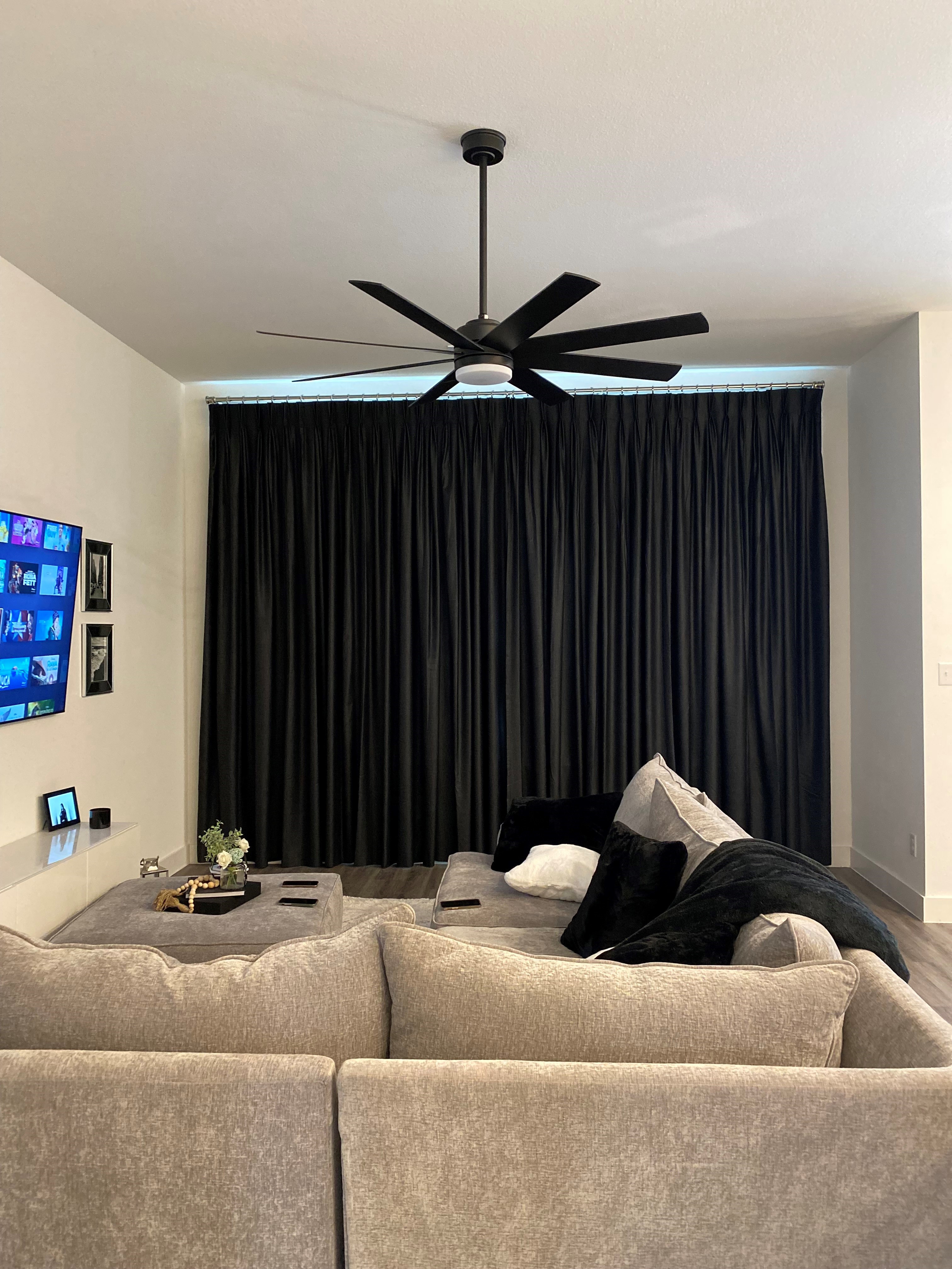 The team at Budget Blinds of Rockwall, Terrell, and Greenville absolutely love the clean, modern look of black drapery for any modern living room.