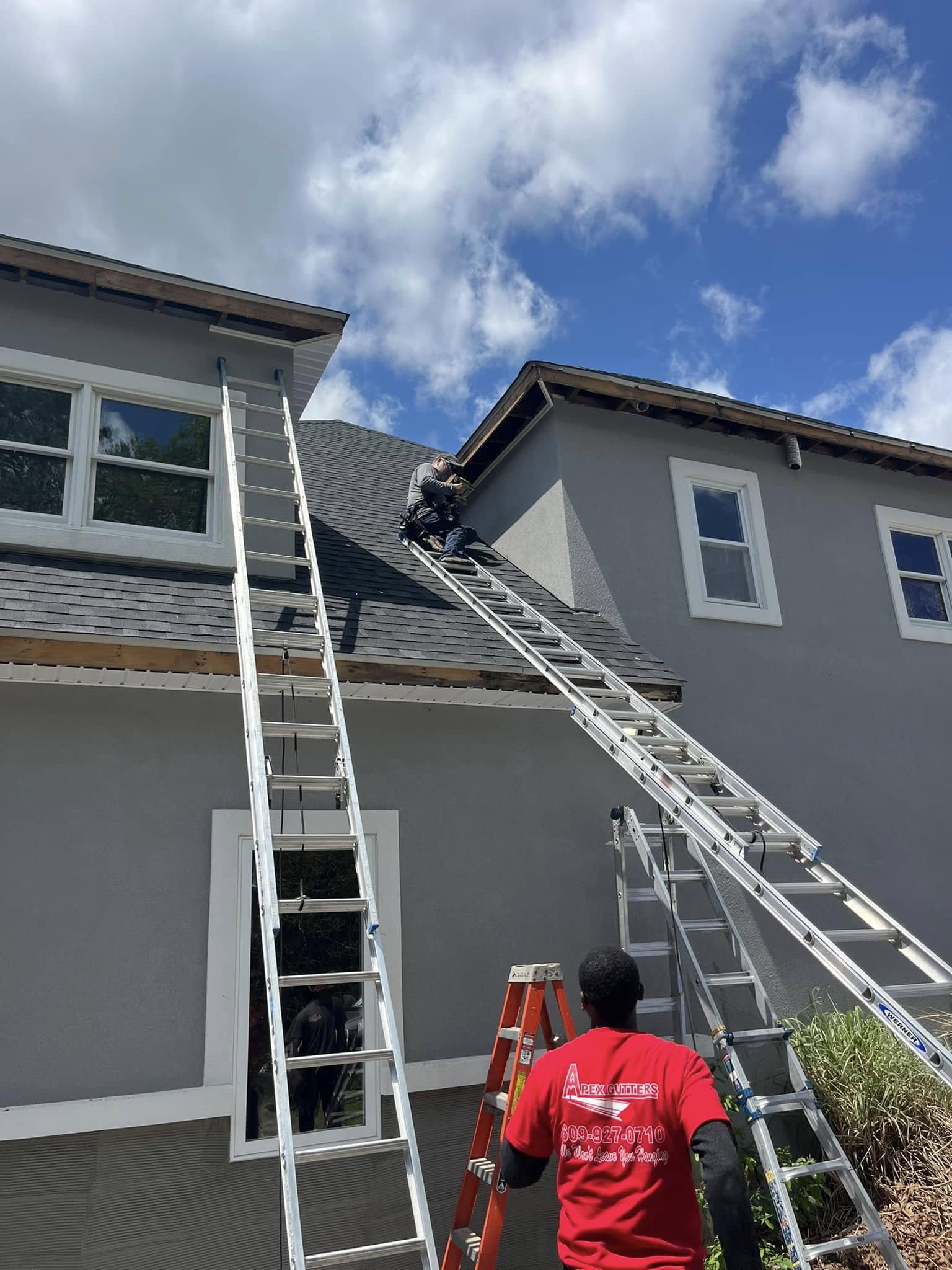 Our team installing new gutters