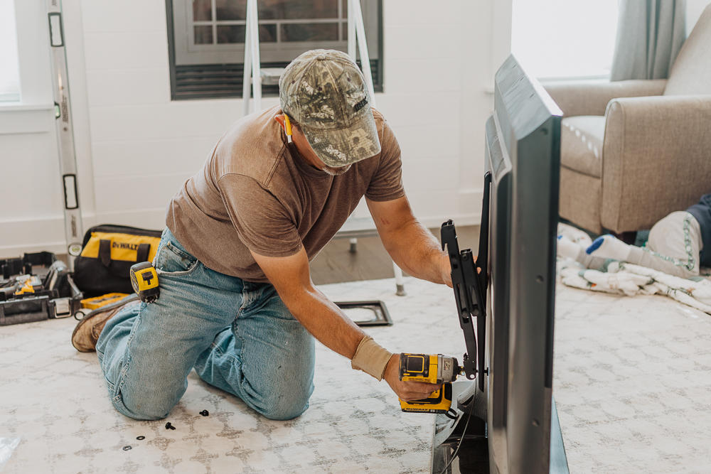 Handyman installing a tv mount in Cache Valley Utah