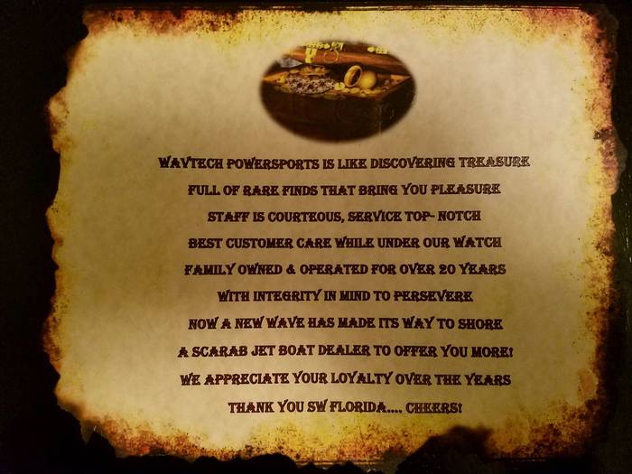 A vintage-style document with text in the center and an oval image at the top. The document has a distressed, parchment-like appearance with burnt edges, suggesting an old or thematic presentation. The text is in a dark, serif font and reads like a company statement or advertisement. The image at the top depicts a treasure chest overflowing with coins and jewelry.