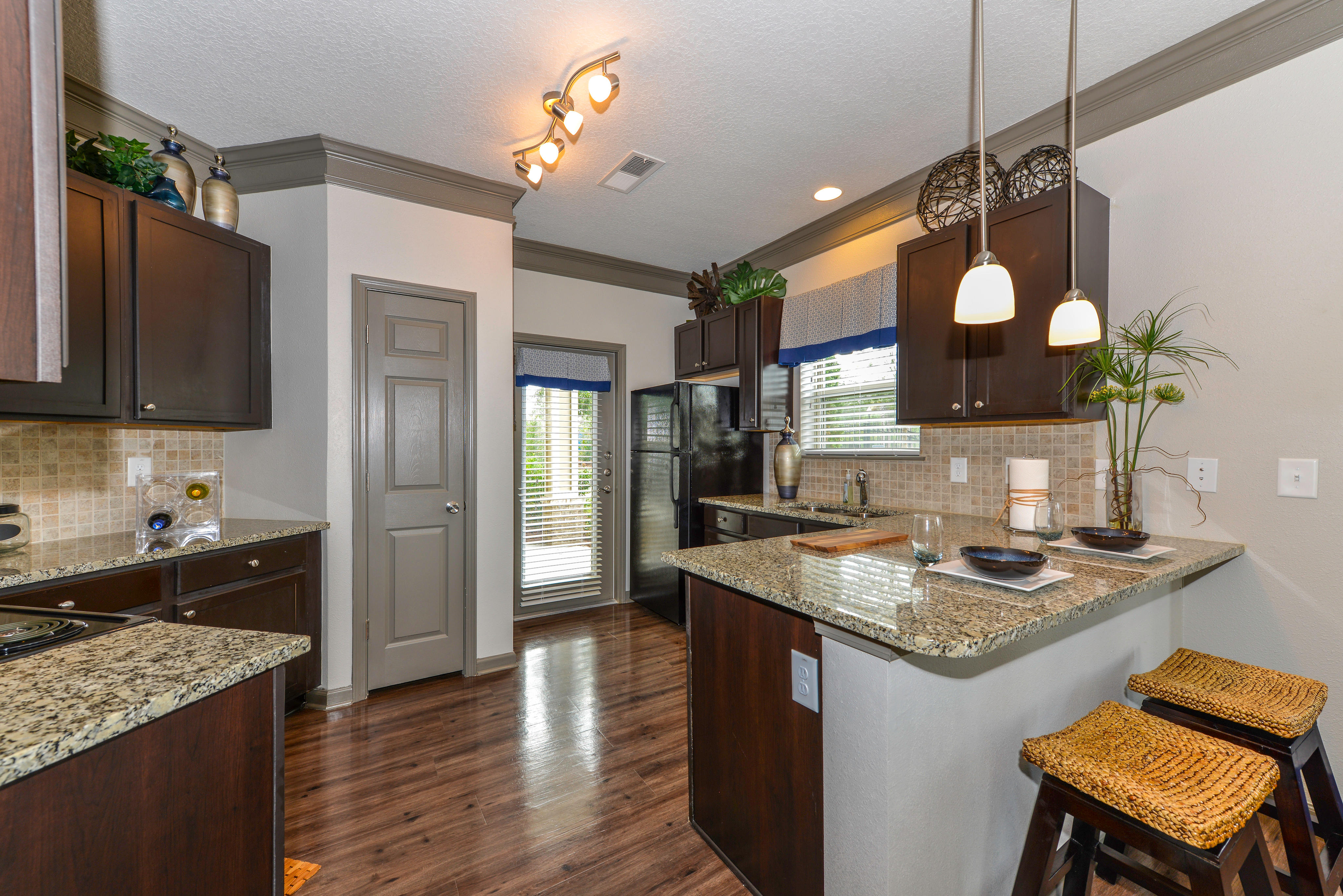 Premium Kitchen With Granite Countertops & Wood-Style Flooring