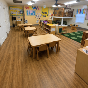 Bright and colorful preschool classroom at Childcare Network with age-appropriate learning materials