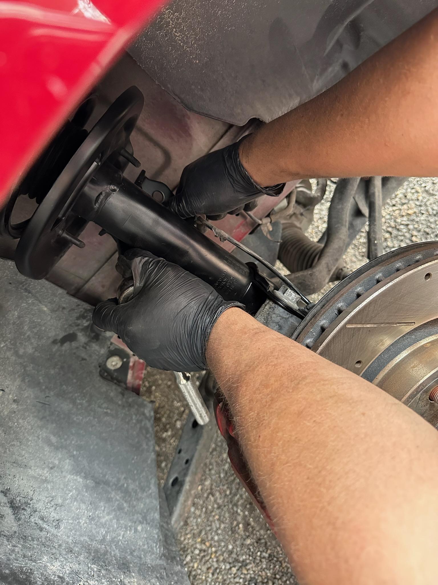 Auto Mechanic working on tools