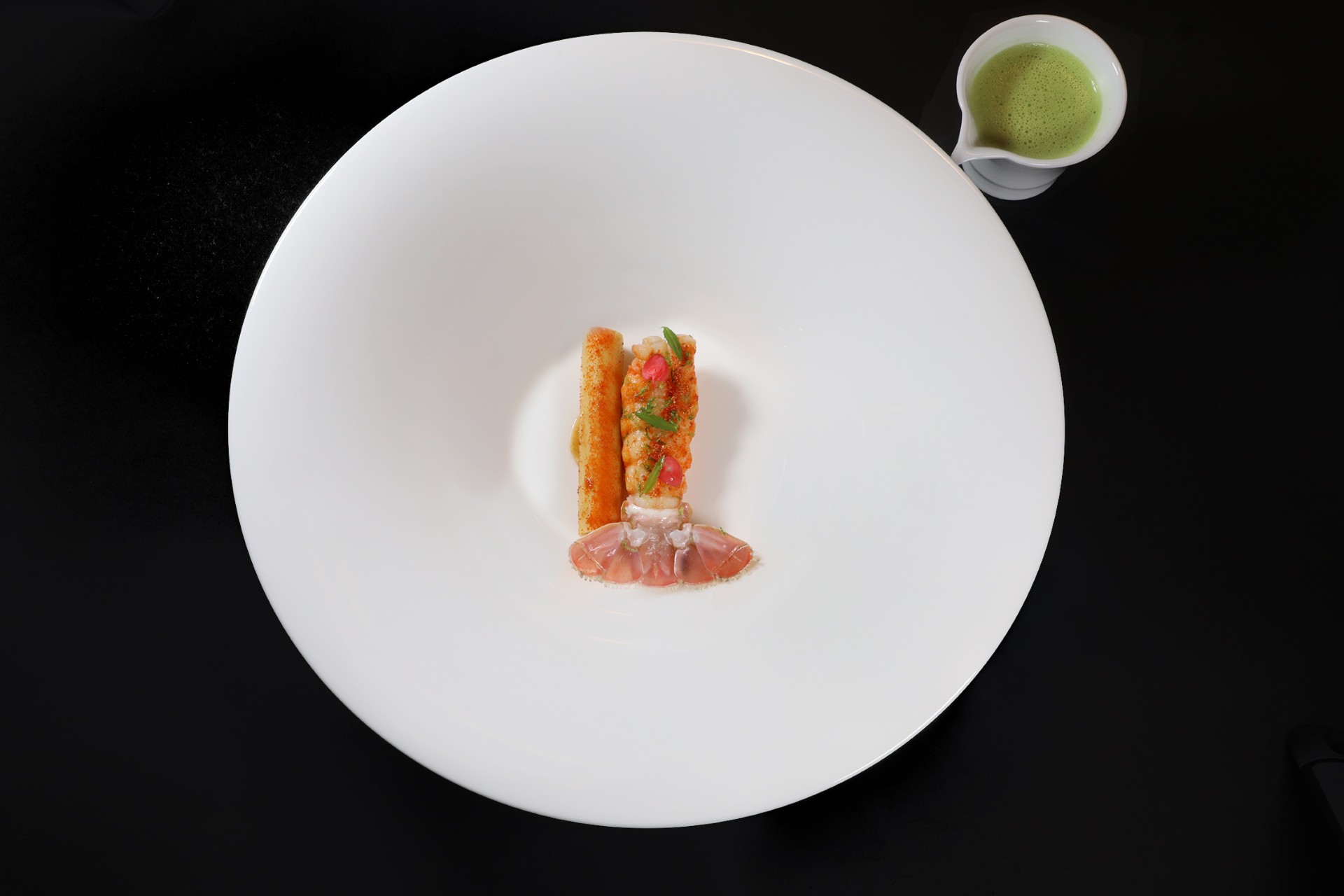 Langoustine, slightly cooked, with stuffed zita, swarnadwipa and green curry. Served on the Discovery Menu and the Chef's Tasting Menu at Essential by Christophe.
