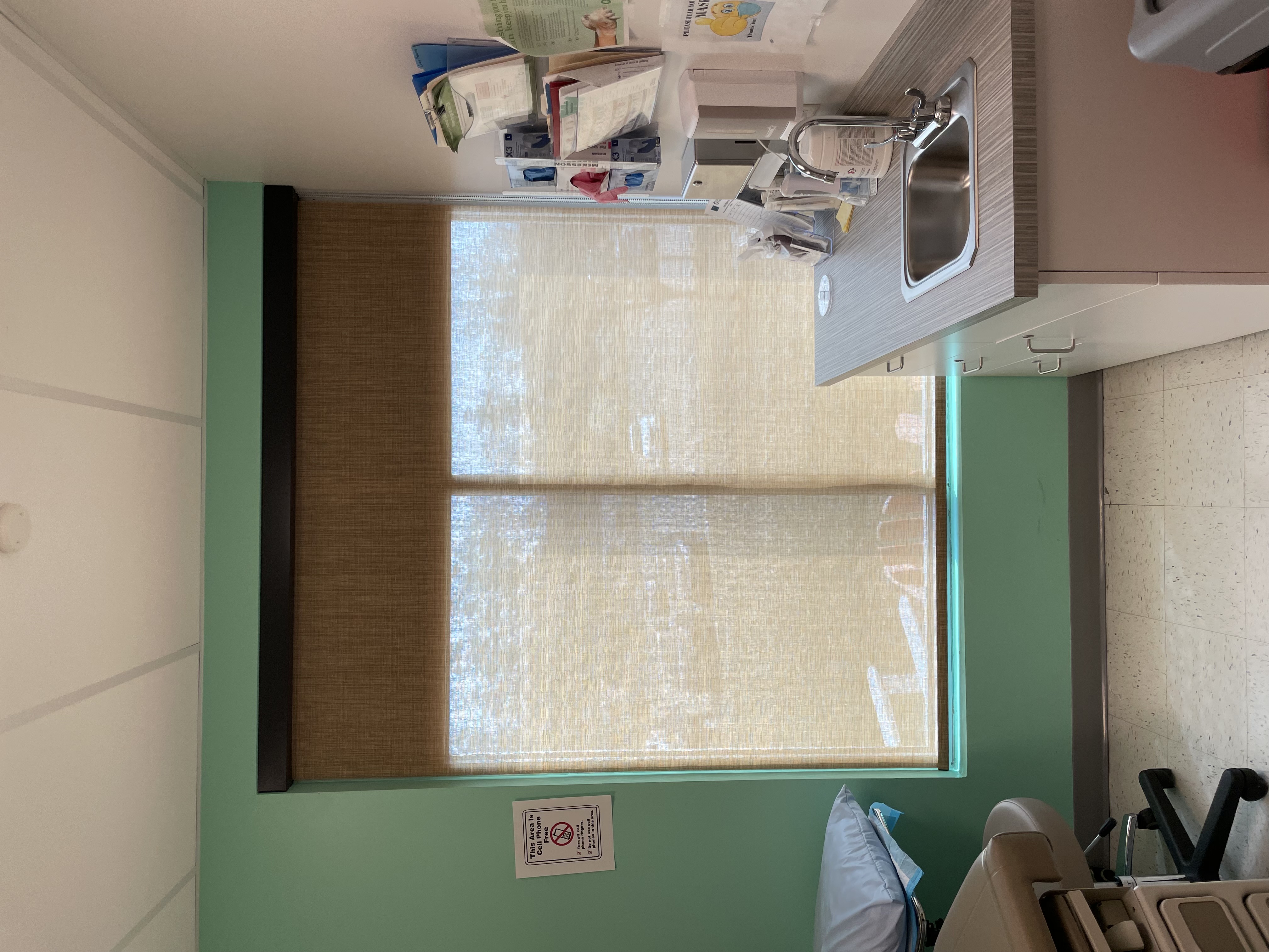 We also do commercial spaces, as well as residential.    This solar roller shade is perfect for the needs of this exam room.