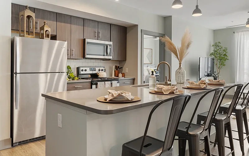 Open concept kitchen with island and stainless steel appliances
