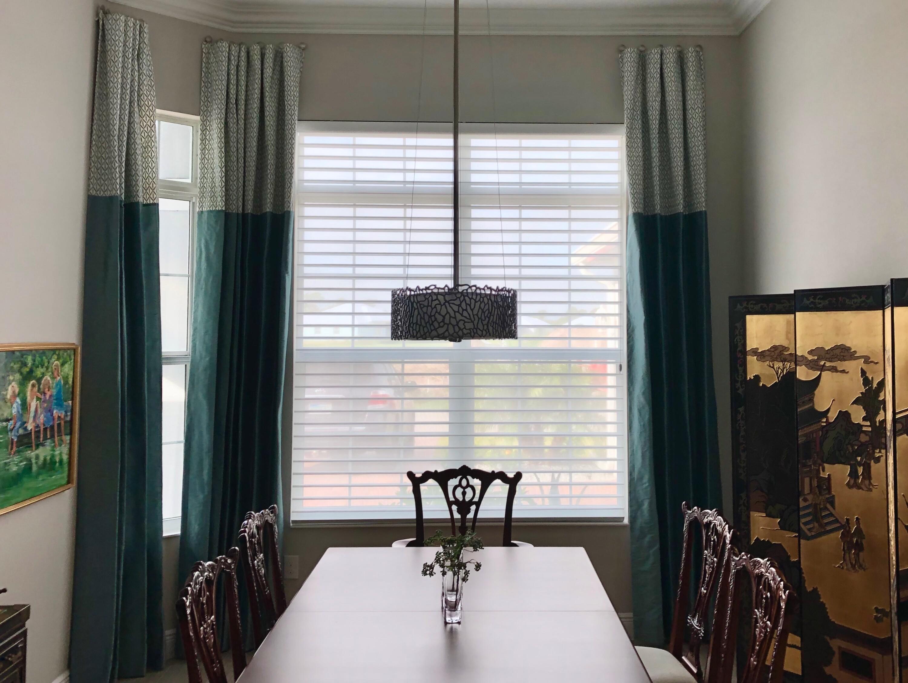 Make room for fun! These drapes add a perfect pop of color in this Cocoa dining room. Choose from hundreds of captivating colors, fabrics, and textures that instantly transform a room or your entire home. Call now to schedule your free in-home consultation!