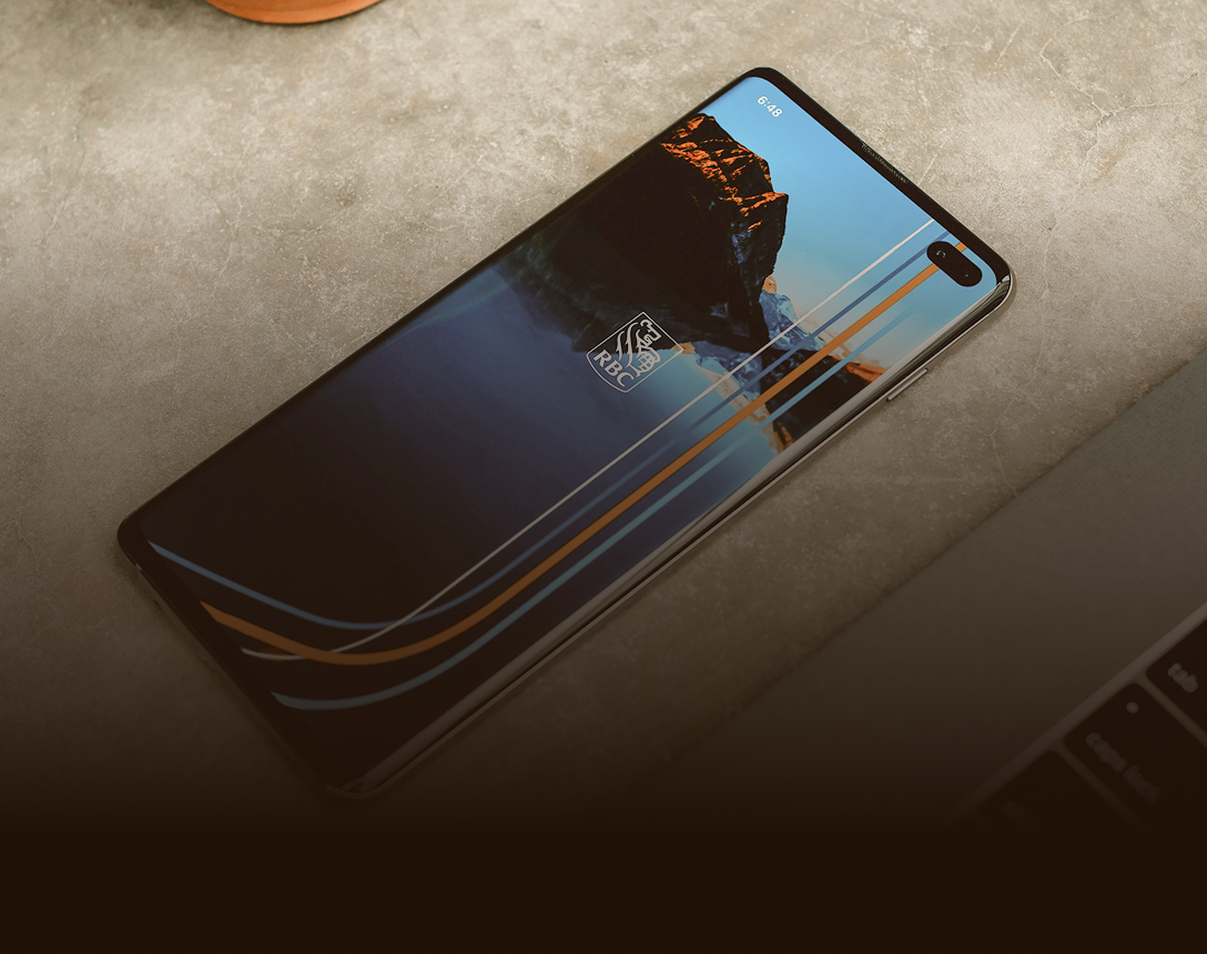 Phone with the RBC Mobile app on the screen.