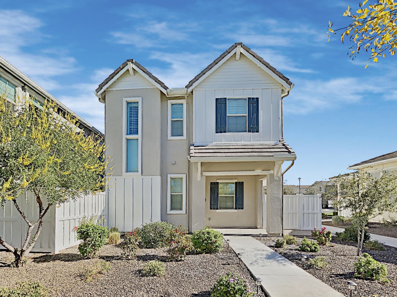 Unique home with long walkway and fenced yard at Invitation Homes Phoenix.