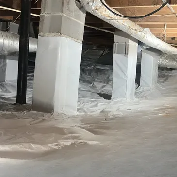 Foundation wall inspection inside a crawl space showing concrete block construction, exposed rock formations, ductwork, and signs of potential moisture concerns requiring evaluation.