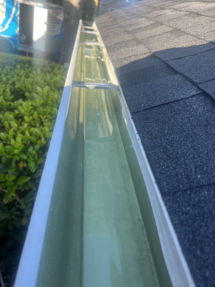 Professional gutter cleaning in Davenport, FL, removing leaves, dirt, and debris to help restore proper water flow.