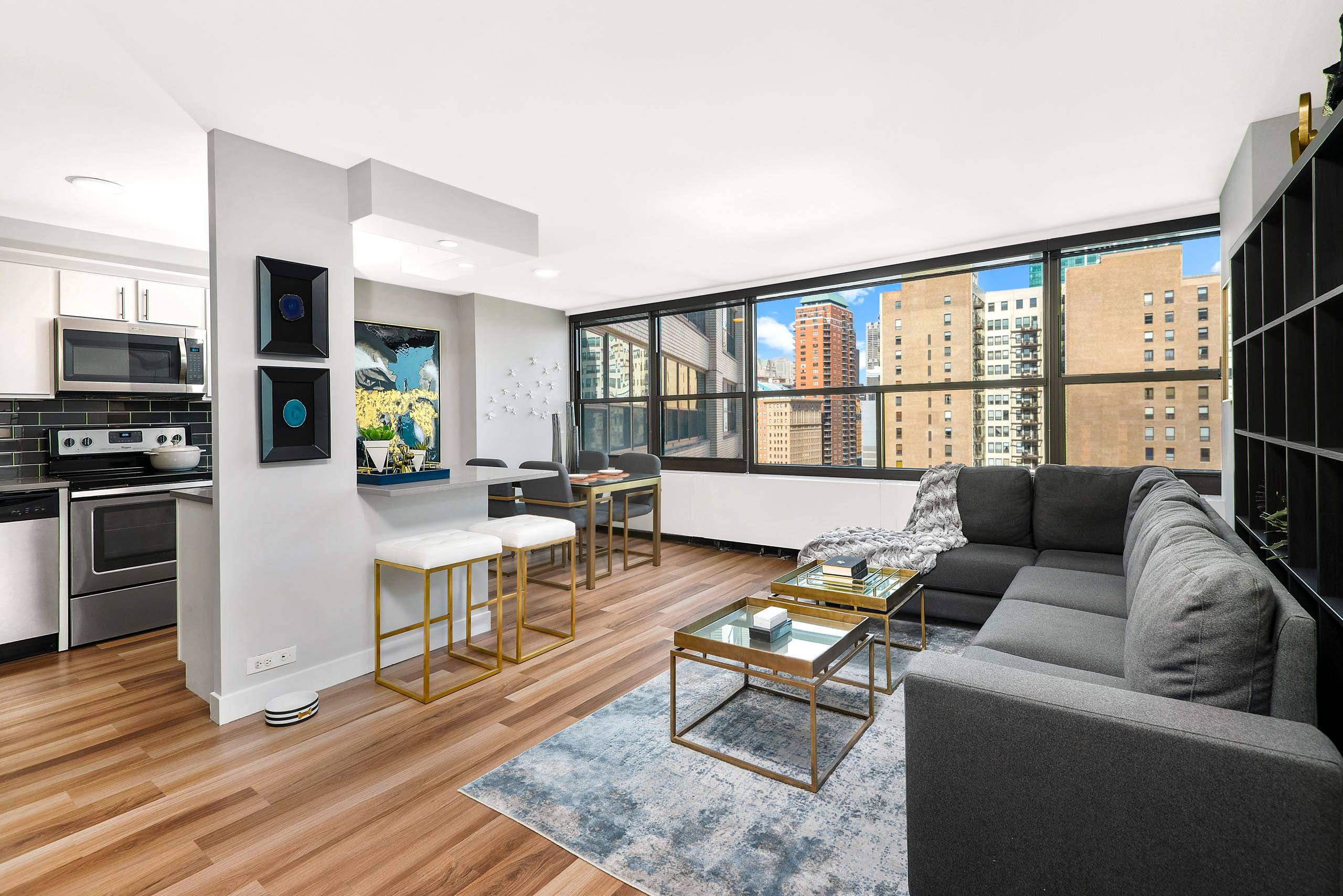 Open concept living room with city views and contemporary furnishings 