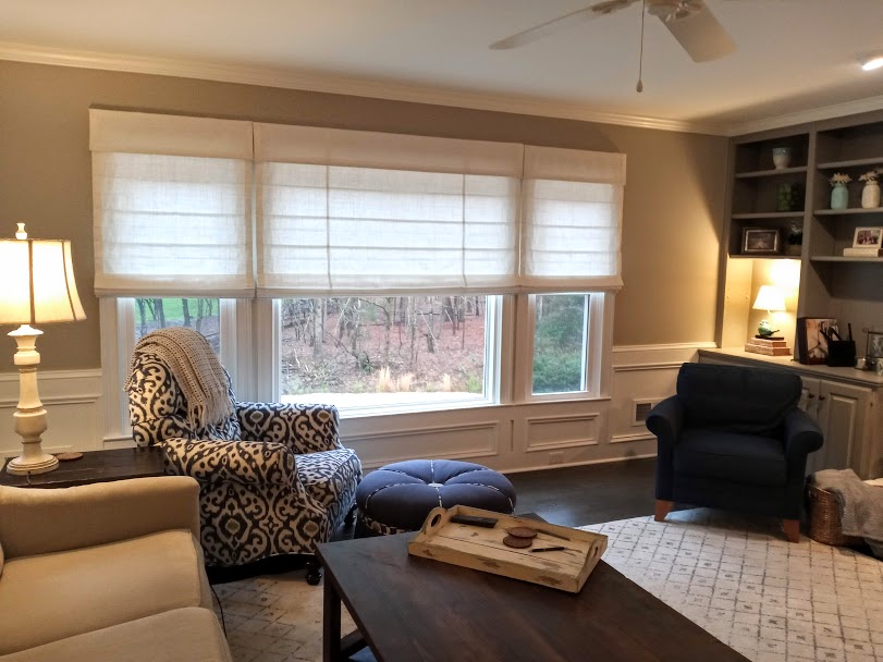 Doesn’t this living room make you want to curl up with a good book? The interior designer who worked with us on this project has created a comfortable, cozy space for the family to enjoy. We were happy to have our Roman Shades be included in this project.