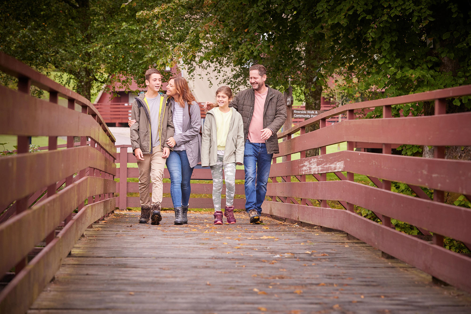 Family take a stroll through the grounds of Drimsynie Estate