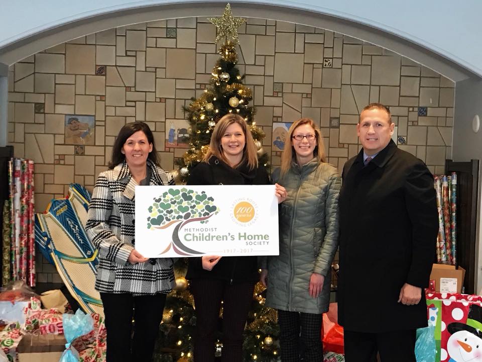 Title One, Inc. team at a charity event.