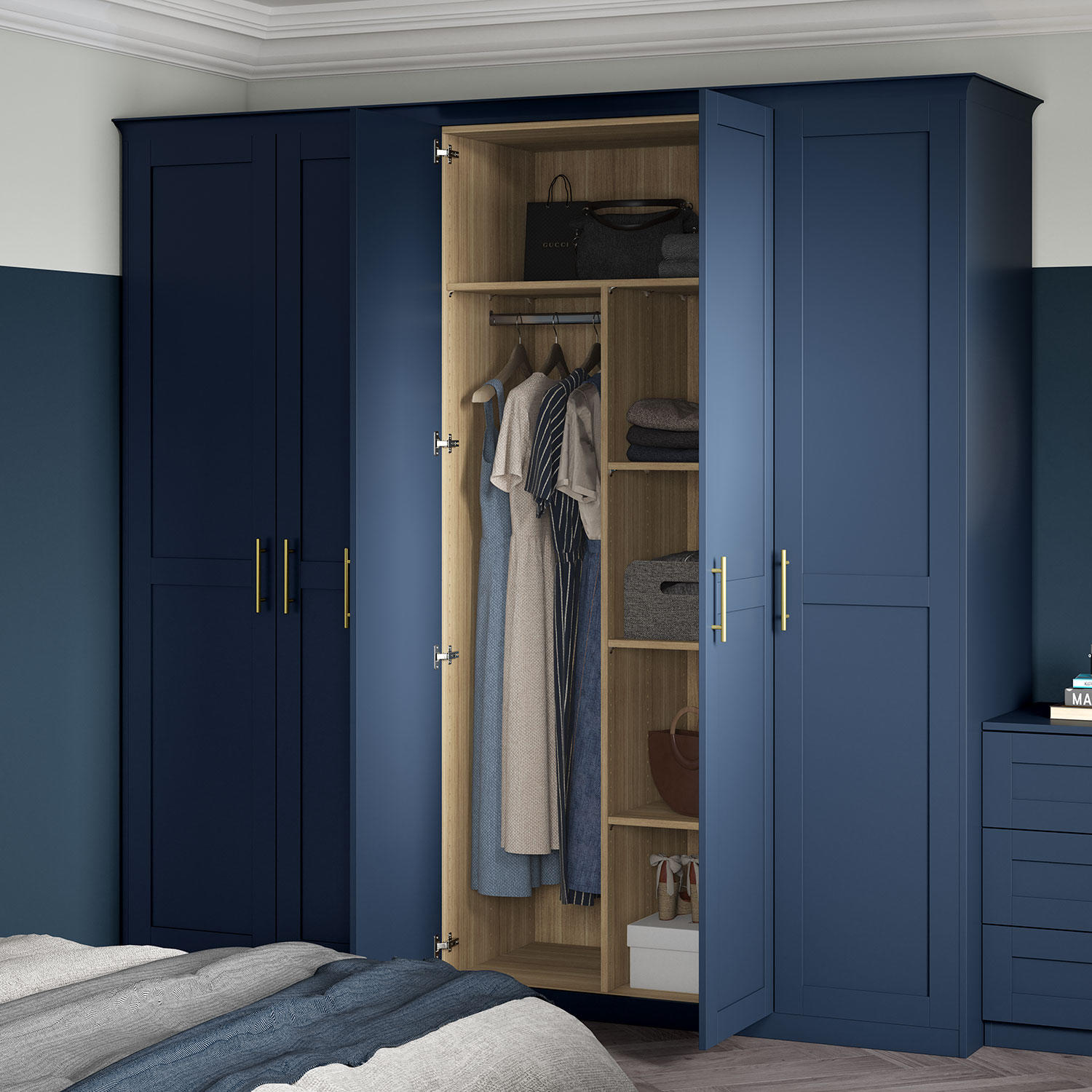 A navy Realm fitted wardrobe with internal storage solutions