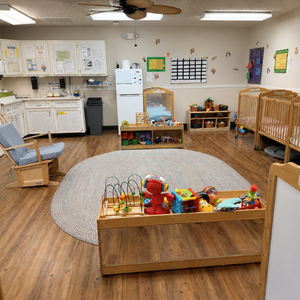Bright and colorful preschool classroom at Childcare Network with age-appropriate learning materials