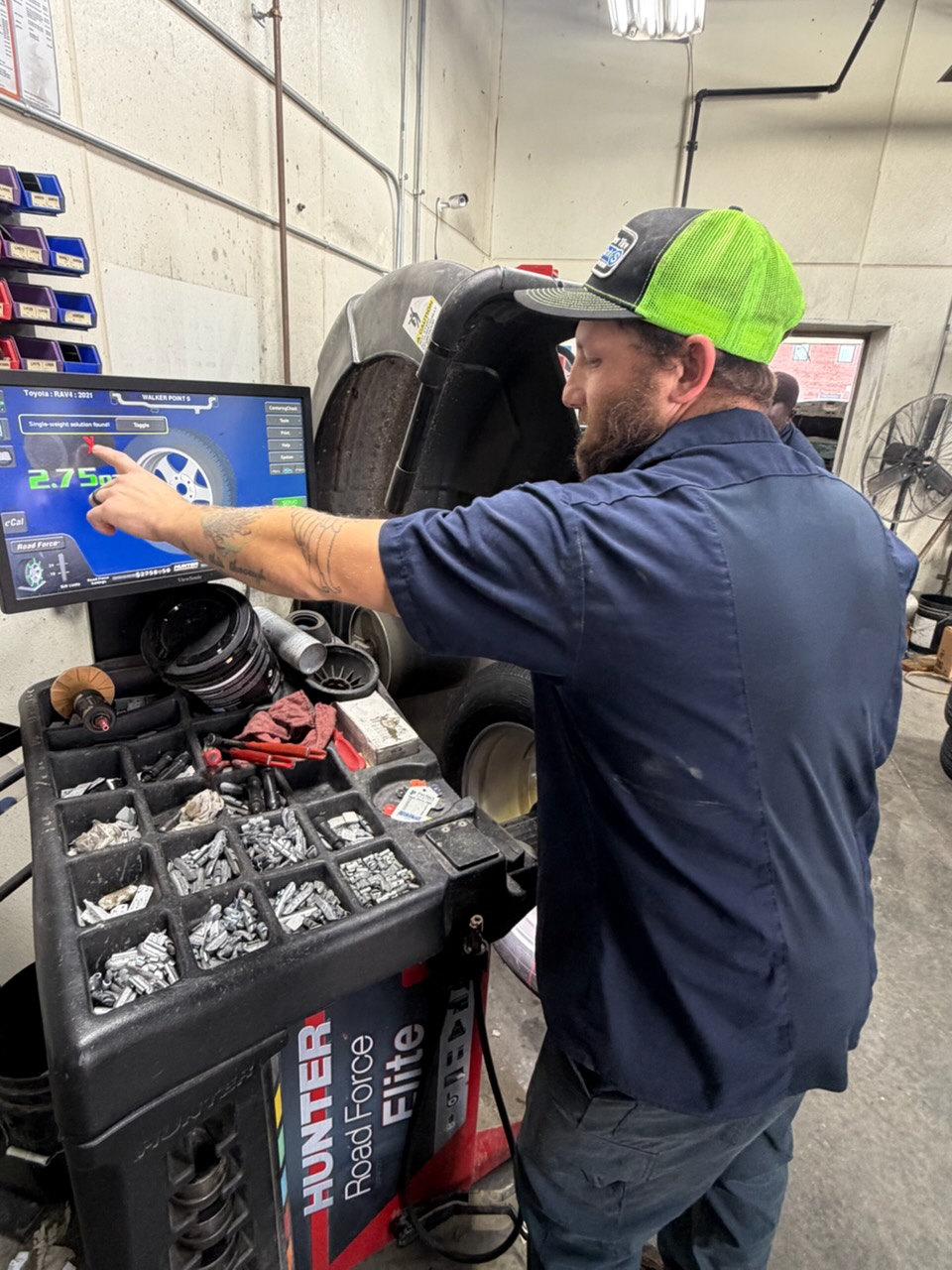 Walker Tire Point S technician performing automotive service at our Downtown Lincoln location. 