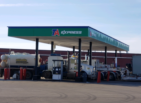 Make TA Express in Alexander, ND on US Highway 85 & SR 68 a part of your route. We’re ready to fuel your trip with Exxon gas or diesel 24/7. Refresh after a long day on the road in our sparkling clean restrooms or use our laundry and shower facilities. Grab fast food at Hot Stuff Pizza or Champs Chicken. We invite professional truck drivers to park with us overnight in our 55 truck parking spaces, relax in our driver’s lounge or weigh in at our CAT scale. Don’t forget to stock up on grab-and-go meals, snacks and drinks at our travel store before returning to the road.