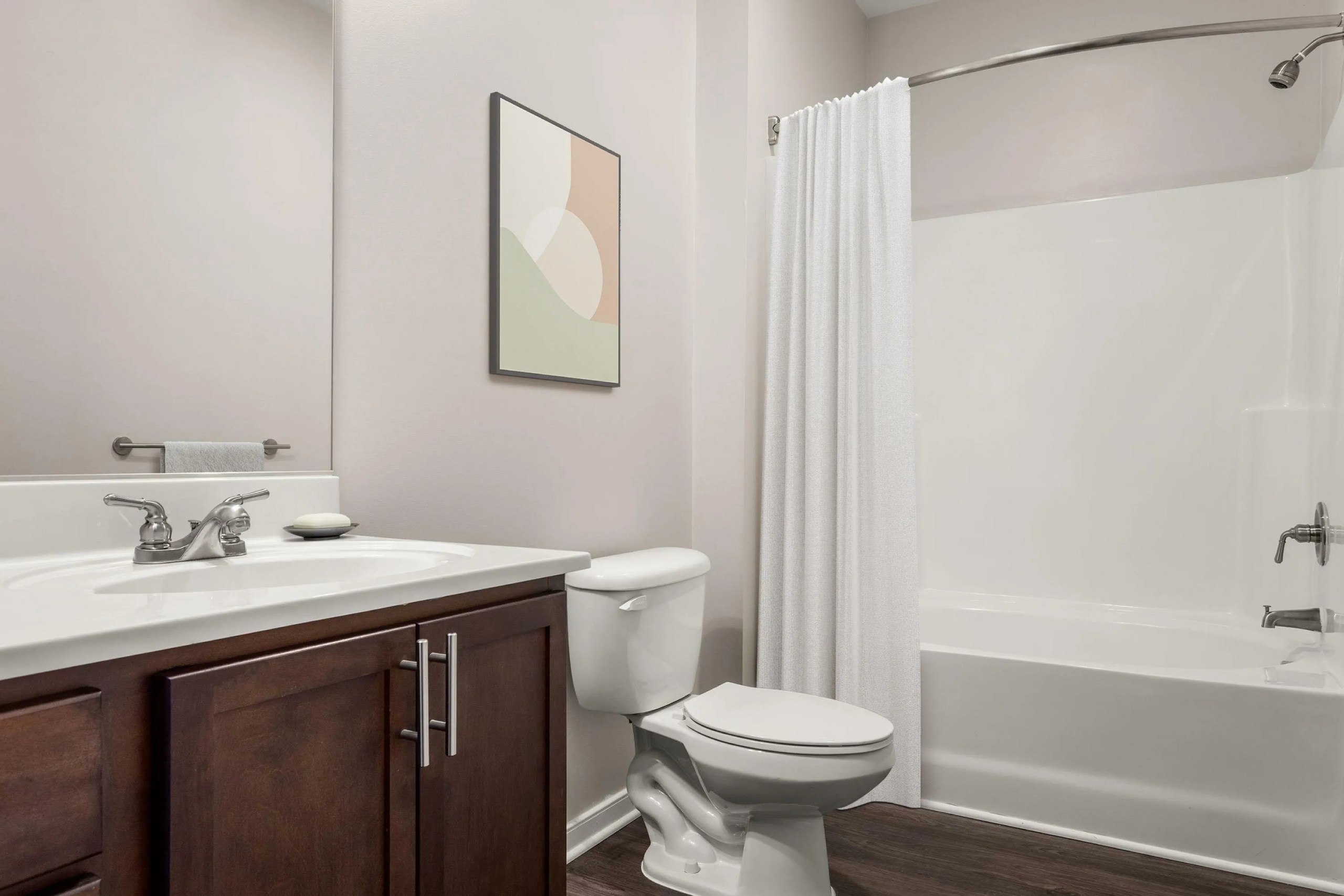Bathroom with white tub and shower curtain