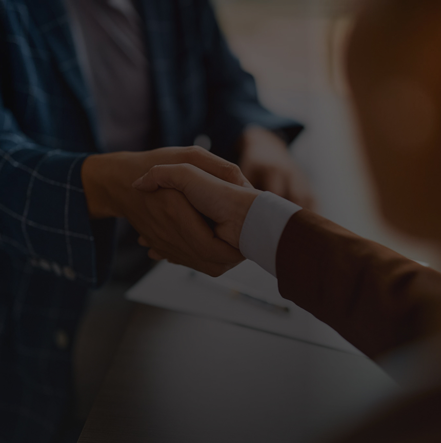 Close-up of two people shaking hands.