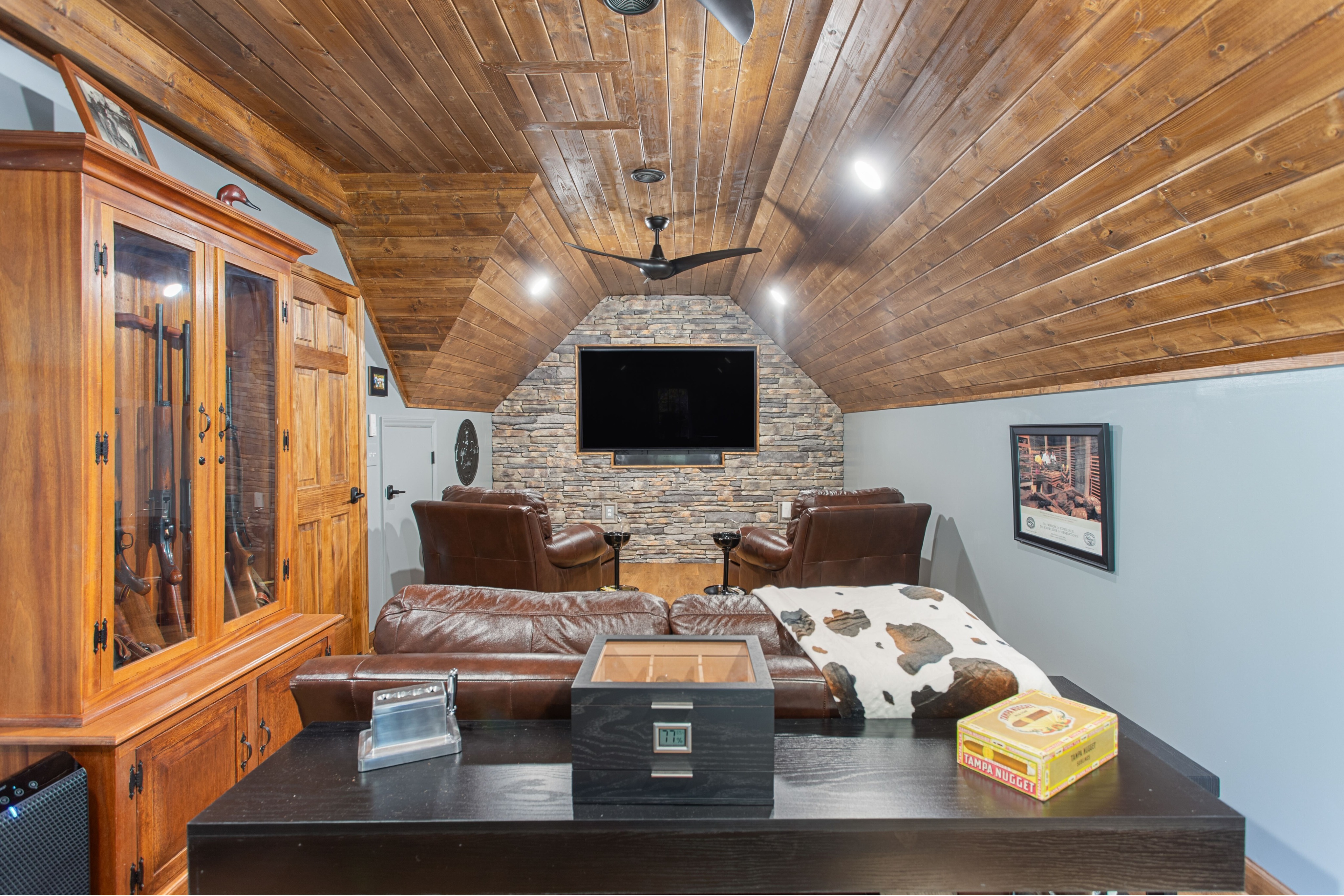 Custom finished interior space in Central North Carolina featuring a stained wood ceiling, built-in cabinetry, and custom trim work. This project highlights expert carpentry and custom residential construction by a professional general contractor.
