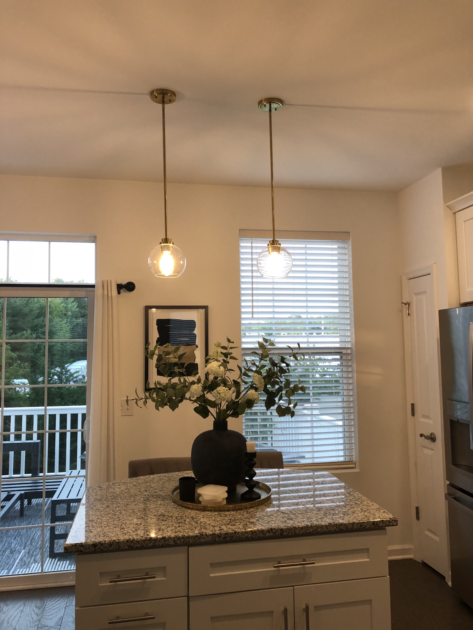 New lighting fixtures for the kitchen island. Lighting from West Elm land Feit Electric 12 watt 2700K LED dimmable bulbs.