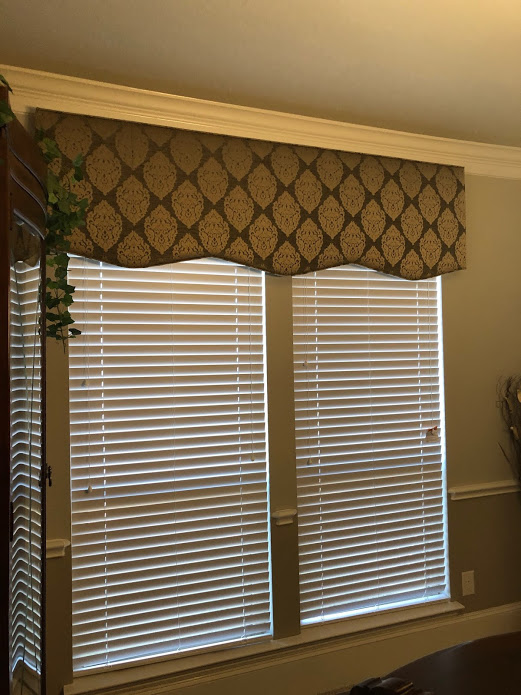 Richmond, TX homeowners took full advantage of controlling light and privacy in elevated style with the use of a custom Cornice Board over Wood Blinds, both by Budget Blinds of Katy and Sugar Land!