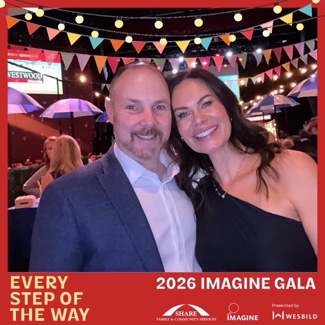 Couple posing at 2026 Imagine Gala event with colorful bunting and festive decorations.