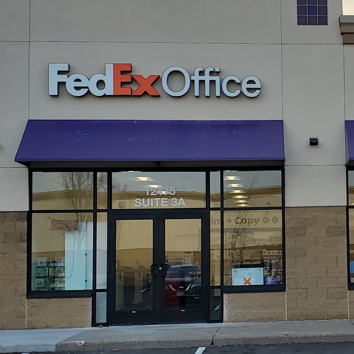 Exterior photo of FedEx Office location at 12475 Riverdale Blvd NW\t Print quickly and easily in the self-service area at the FedEx Office location 12475 Riverdale Blvd NW from email, USB, or the cloud\t FedEx Office Print & Go near 12475 Riverdale Blvd NW\t Shipping boxes and packing services available at FedEx Office 12475 Riverdale Blvd NW\t Get banners, signs, posters and prints at FedEx Office 12475 Riverdale Blvd NW\t Full service printing and packing at FedEx Office 12475 Riverdale Blvd NW\t Drop off FedEx packages near 12475 Riverdale Blvd NW\t FedEx shipping near 12475 Riverdale Blvd NW