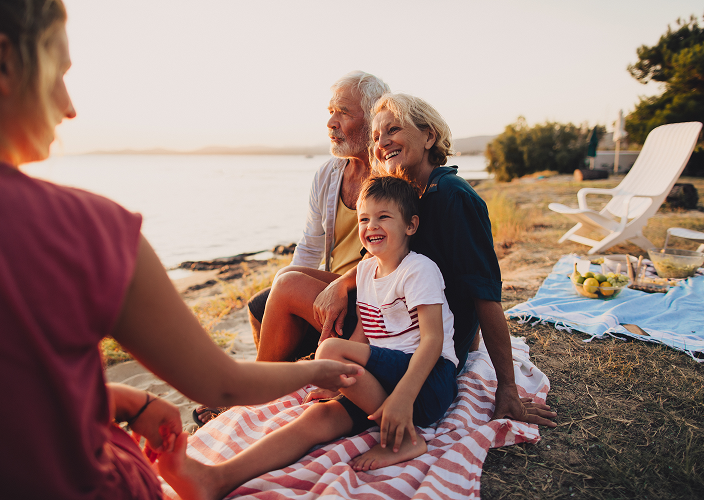 A multigenerational family on the beach.
