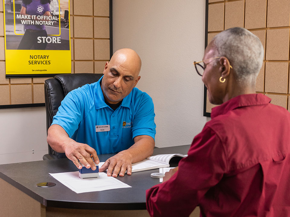 UPS Store Associate assisting customer