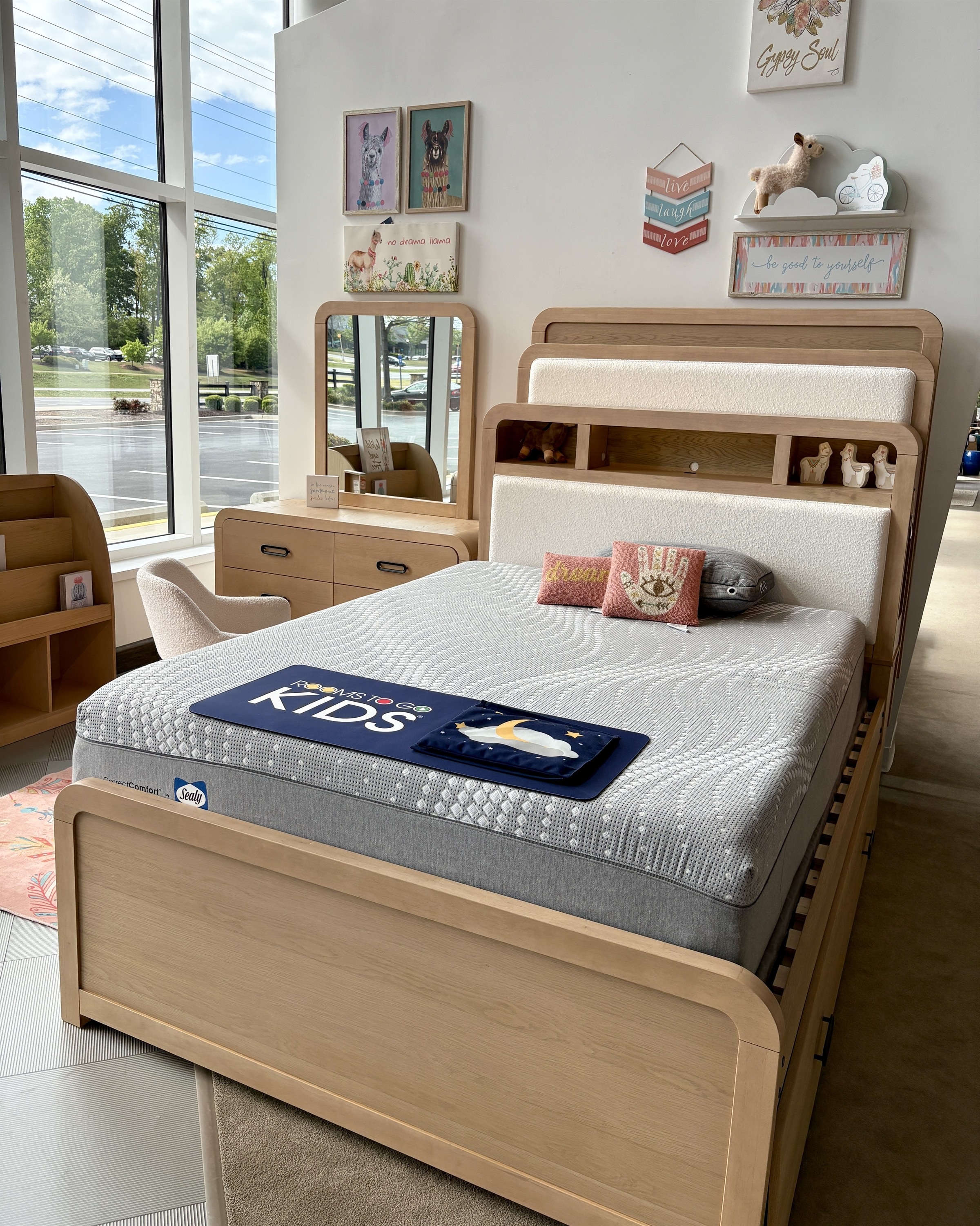 Browse Hidden Hills, a light wood bookcase bed with storage headboard and dresser set at Rooms To Go Kids, styled boho for 2026.