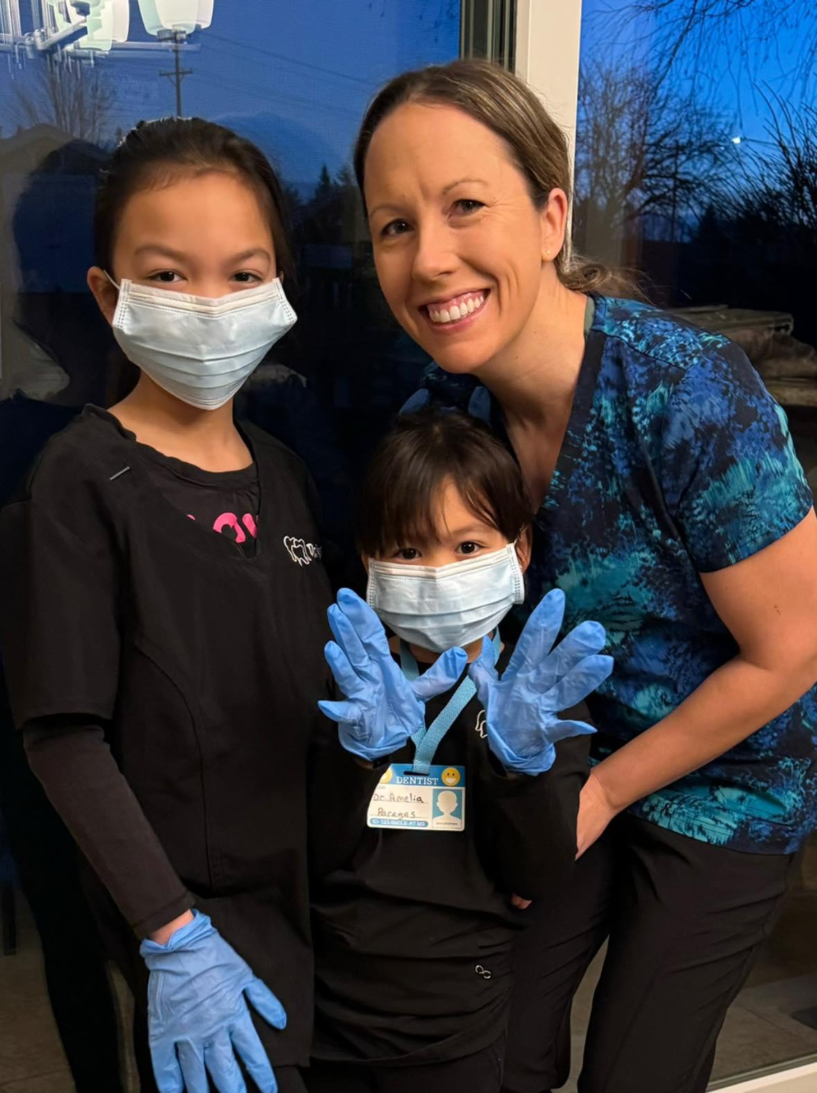 Dr Carly with here little patients in her dental office