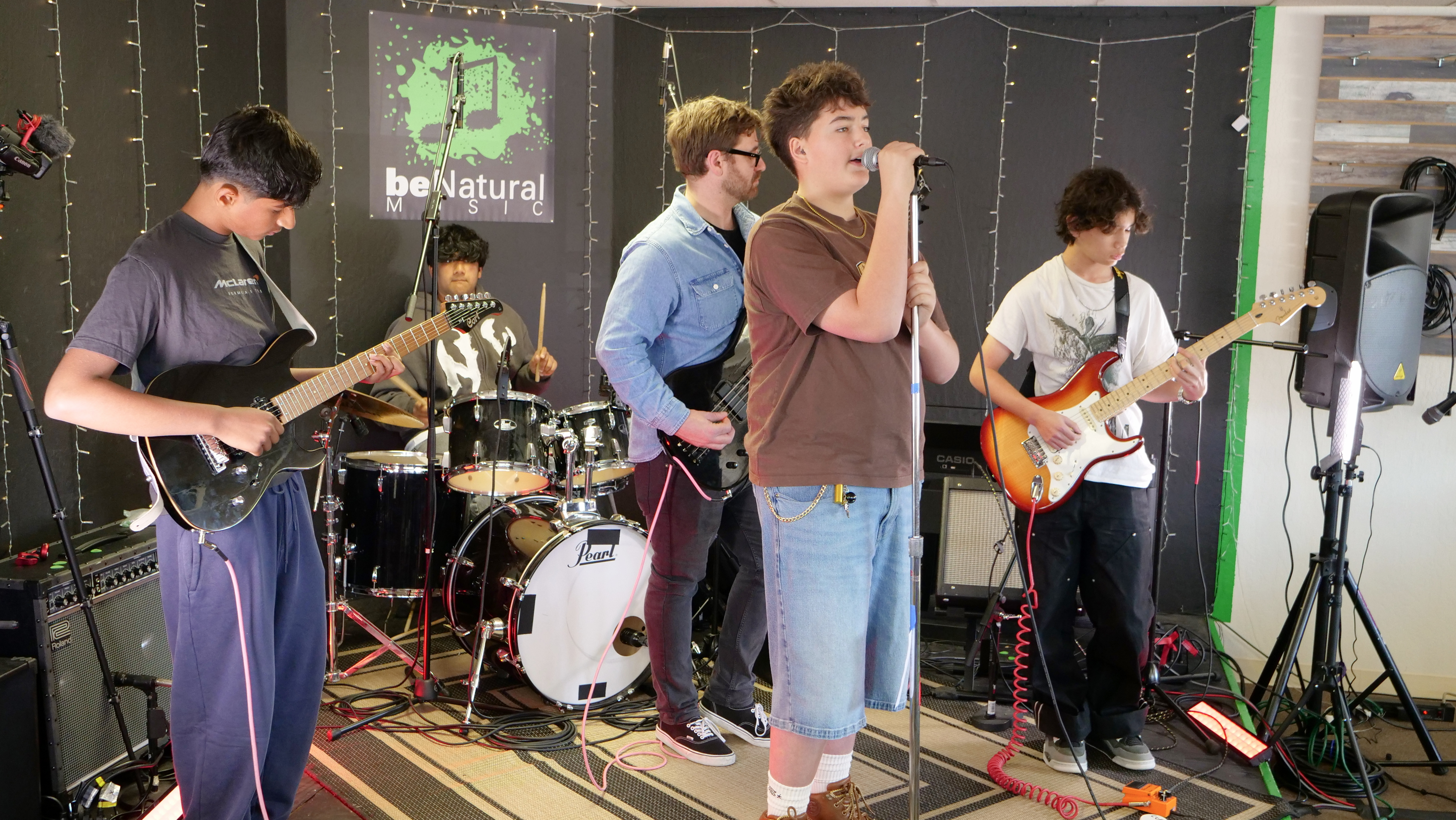 Student band performing together, highlighting group music lessons, teamwork, and stage experience.