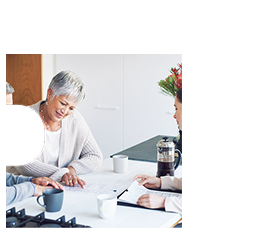 A couple reviewing their finances with an advisor.