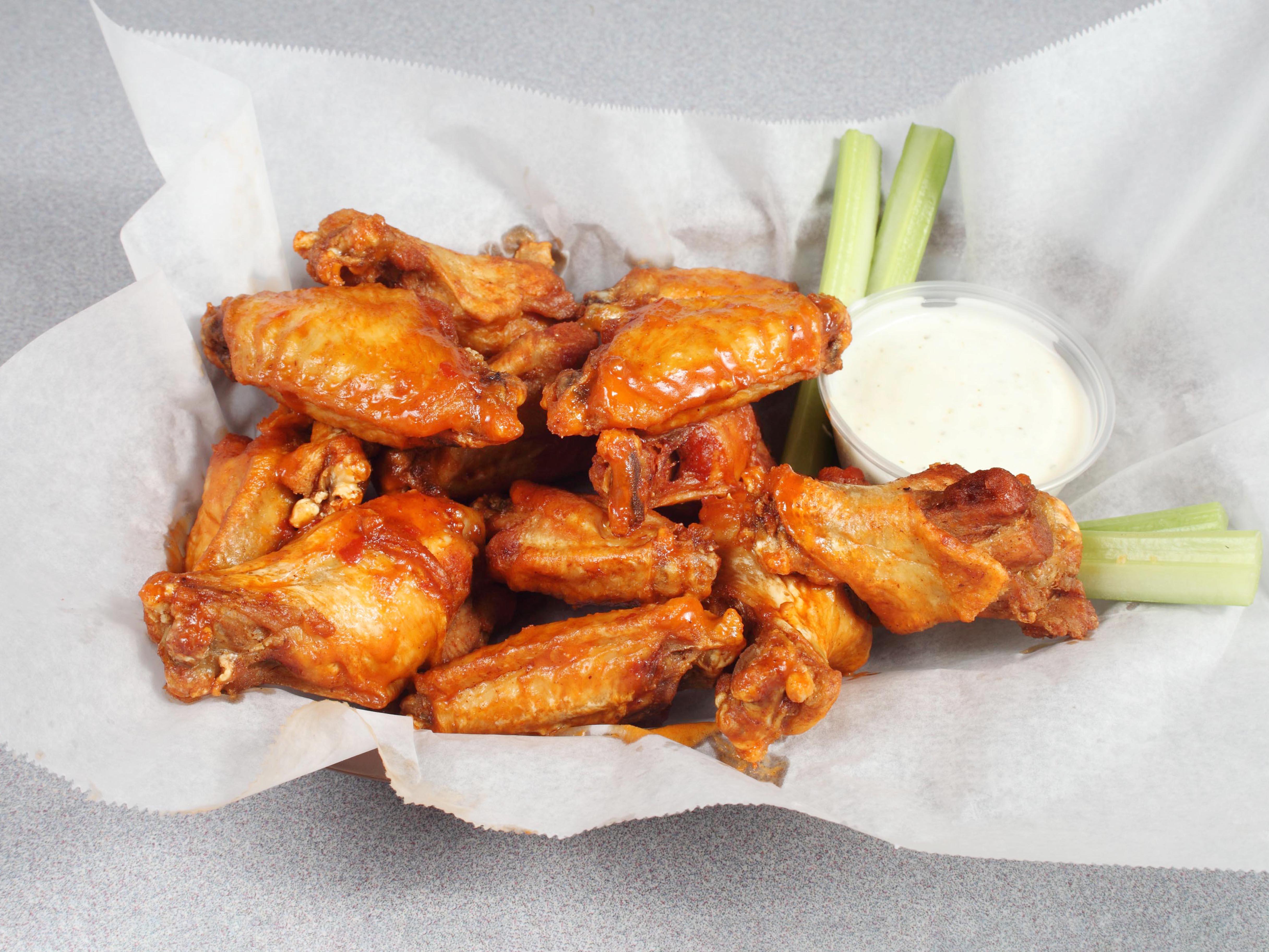 Chicken wings with dressing, celery and your choice of buffalo sauce