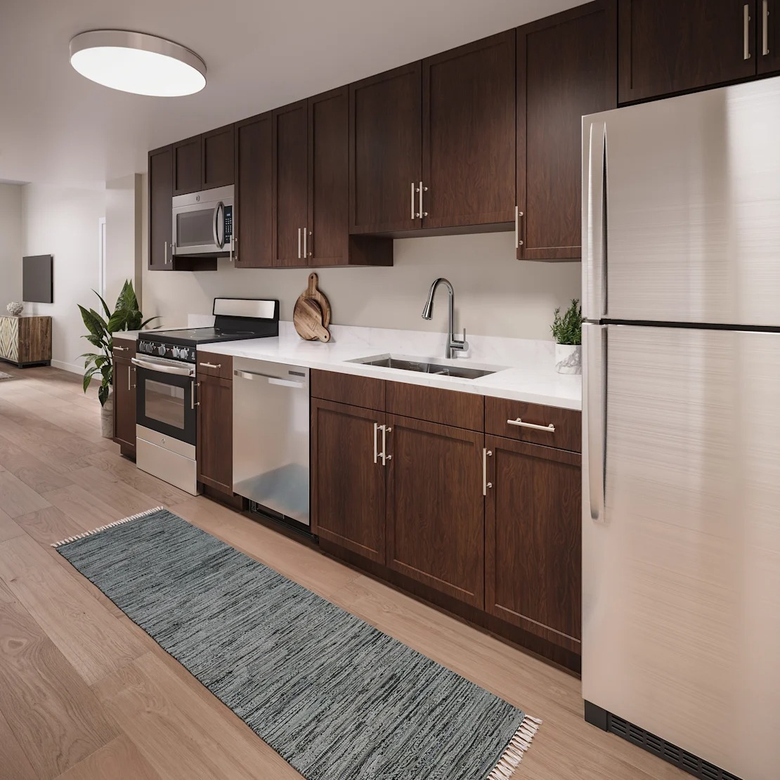 A modern kitchen with wooden cabinets and stainless steel appliances. 