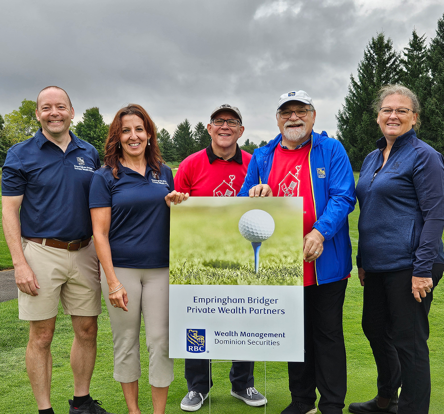 Photo of Empringham Bridger team members posing at the Ronald McDonald House charity golf tournament.